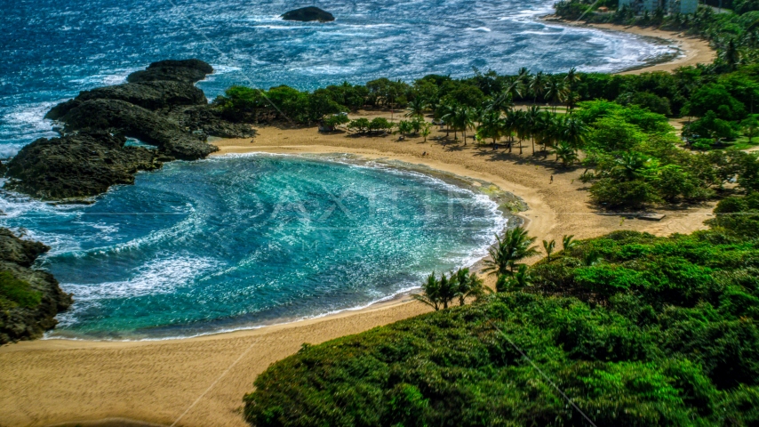 Coastal tide pool and beach in Manati, Puerto Rico Aerial Stock Photo AX101_190.0000167F | Axiom Images