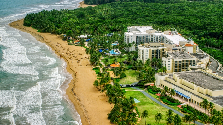 Sunbathers at the oceanfront Wyndham Grand Rio Mar Beach Resort and Spa, Rio Grande, Puerto Rico Aerial Stock Photo AX102_047.0000047F | Axiom Images